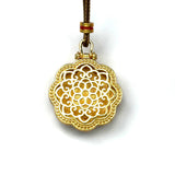 Sand Gold Spinning Mandala Pendant — Reversible Ruby Lotus Necklace